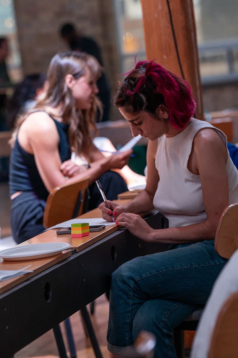Participant of the workshop responding to questions in the booklet